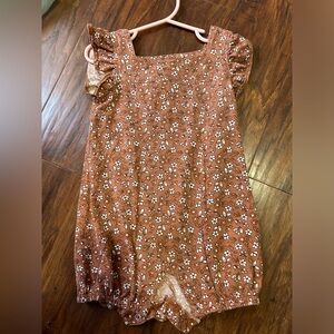 Brown toddler romper with white flowers